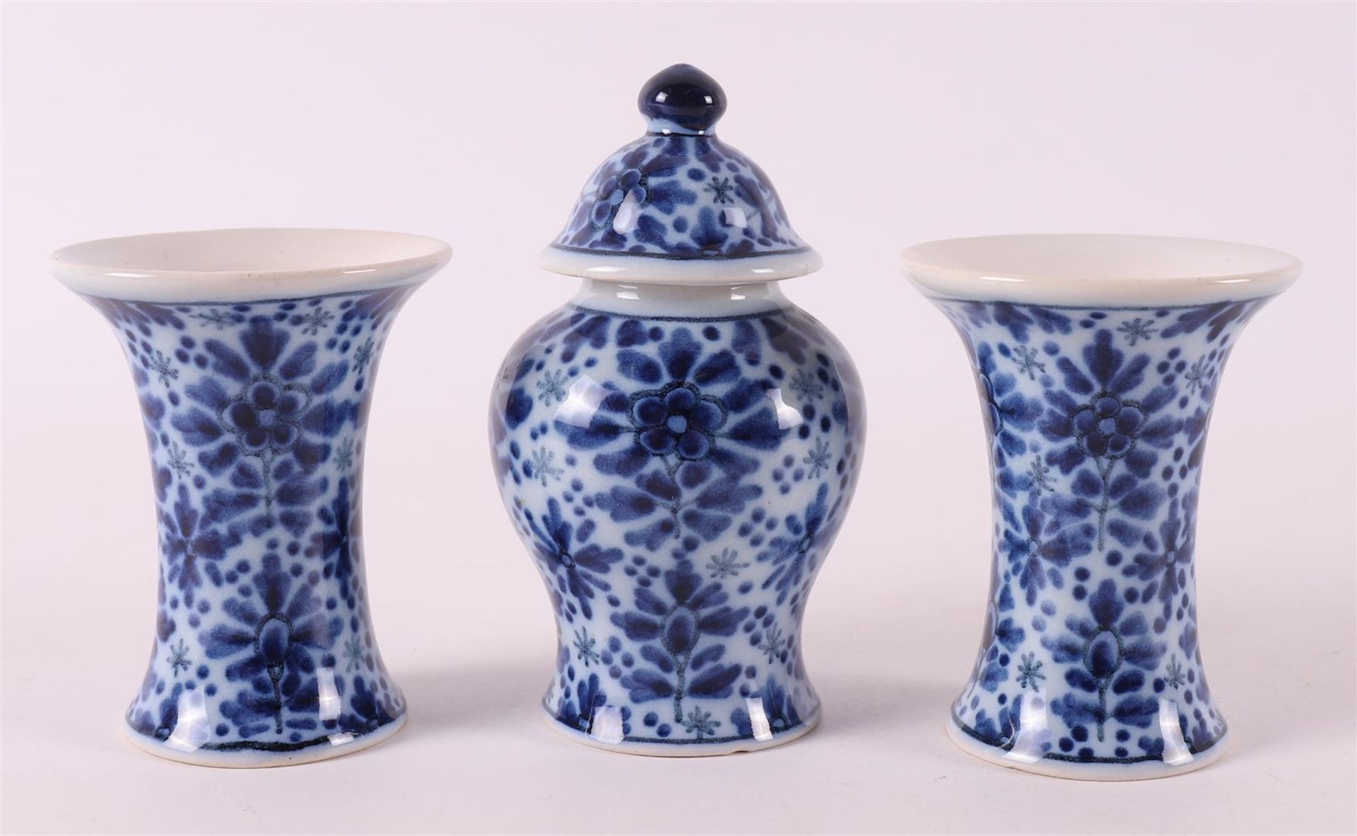 An earthenware miniature garniture, after an antique Chinese example, Makkum Tic