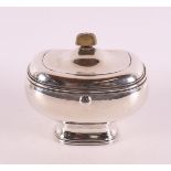 A driven 2nd grade silver tobacco jar with fixed lid and wooden knob.