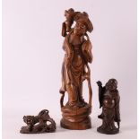 Three various carved tropical wooden figures, China, around 1900.