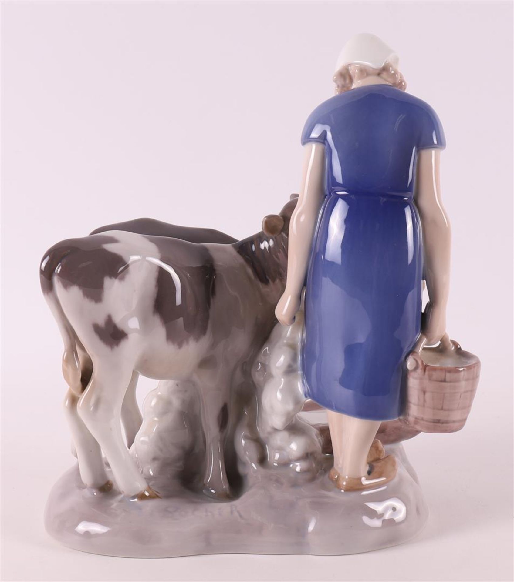 A polychrome porcelain girl with two calves, Denmark, Royal Copenhagen - Image 2 of 6