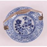A blue/white contoured porcelain dish with silver handle, China.