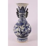 A blue and white baluster-shaped ribbed vase with handles, China, 20th/21st cent