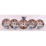 A series of five porcelain Imari cups and saucers, Japan, 19th century.