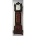 A grandfather clock in mahogany case, England 19th century.