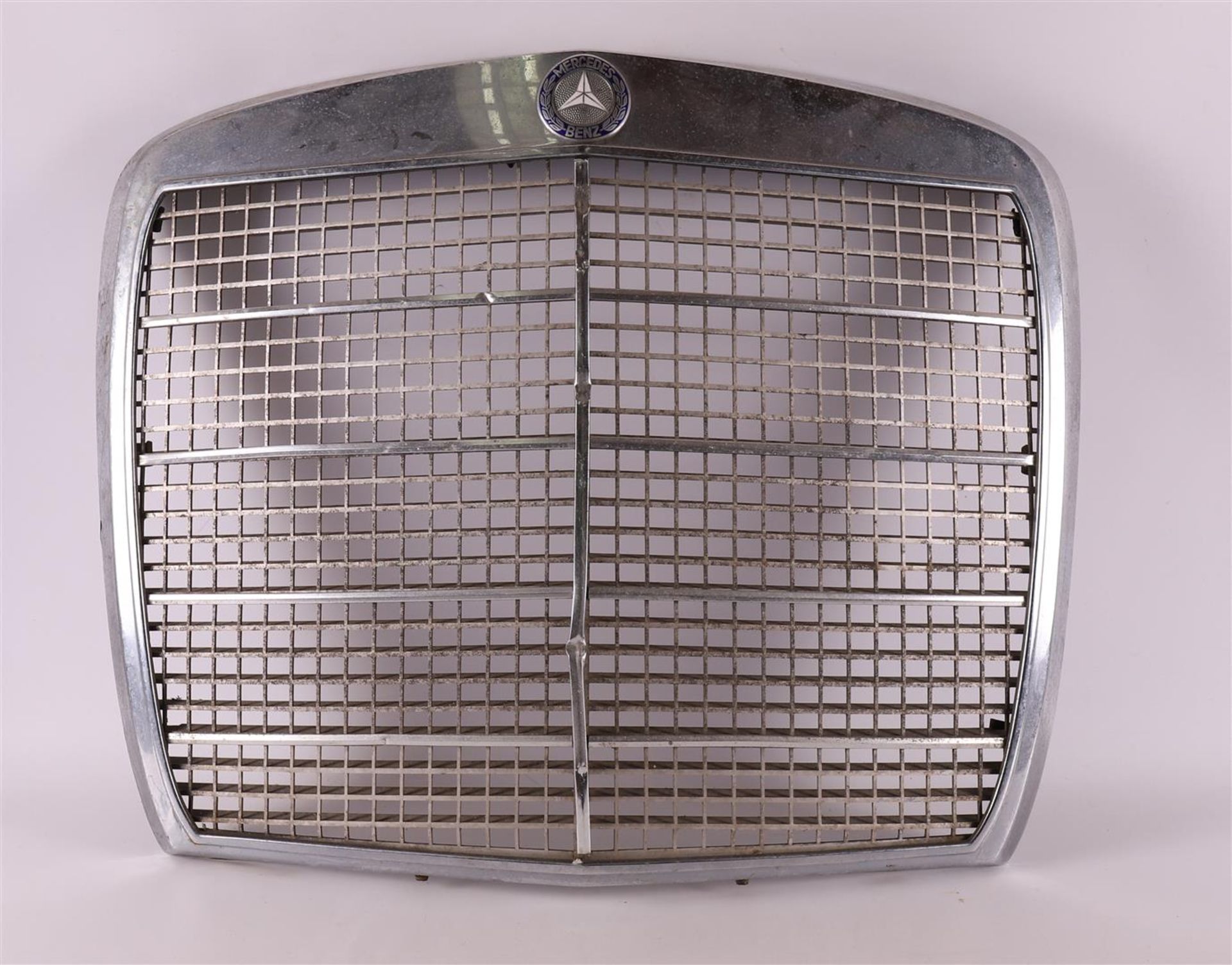 A chrome metal grille from a 1960s Mercedes.