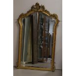 A faceted mirror in gilt ornamental frame, 19th century.