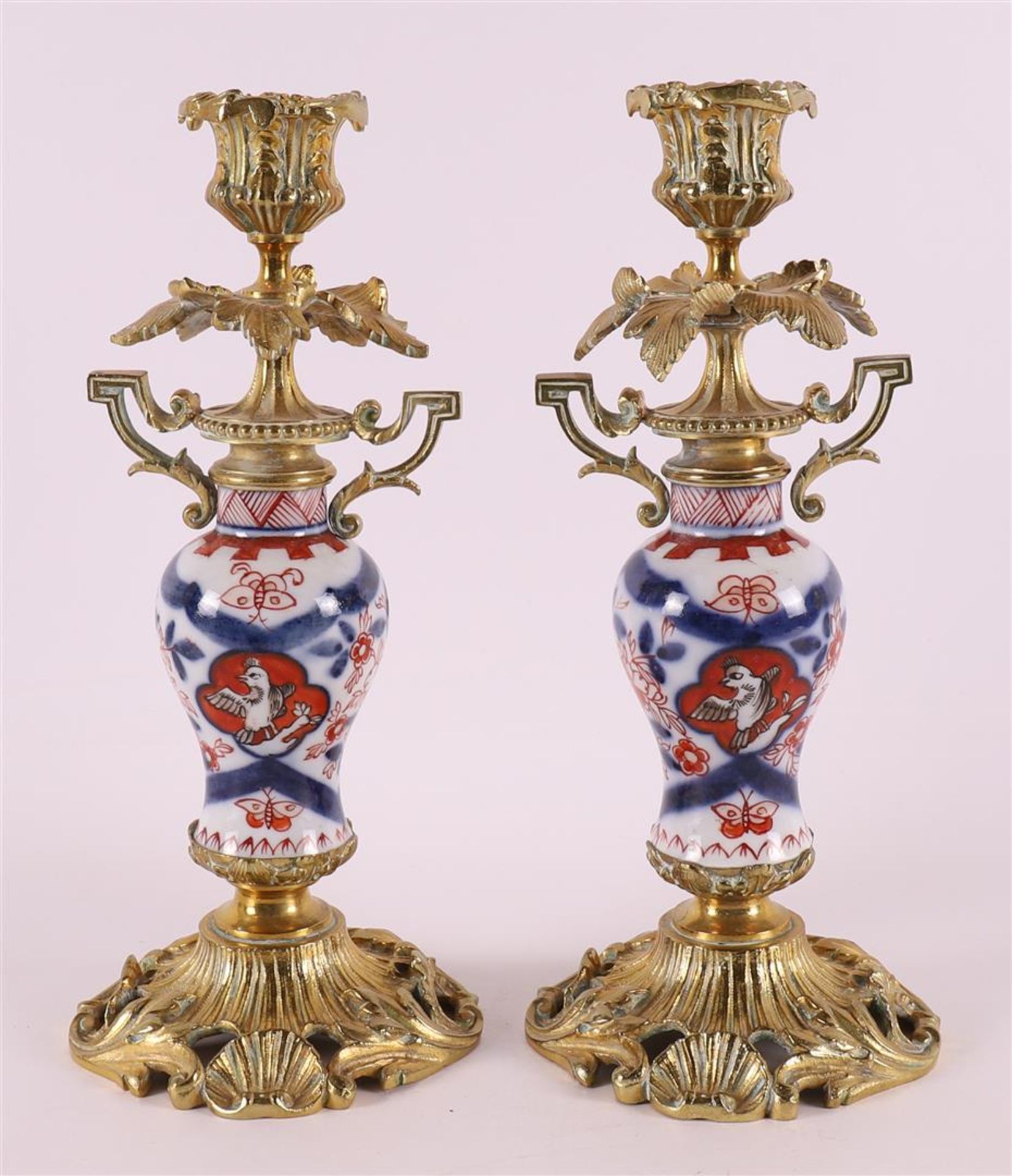 A pair of porcelain Imari one-light candlesticks, Japan, circa 1900.