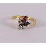 An 18 carat gold ring with 3 brilliants, a marquise cut ruby and sapphires