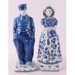 An earthenware farmer and farmer's wife in traditional costume, De Porceleyne Fl