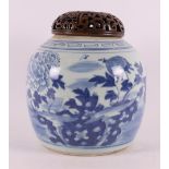 A blue and white porcelain ginger jar with pierced wooden lid, China, 19th centu