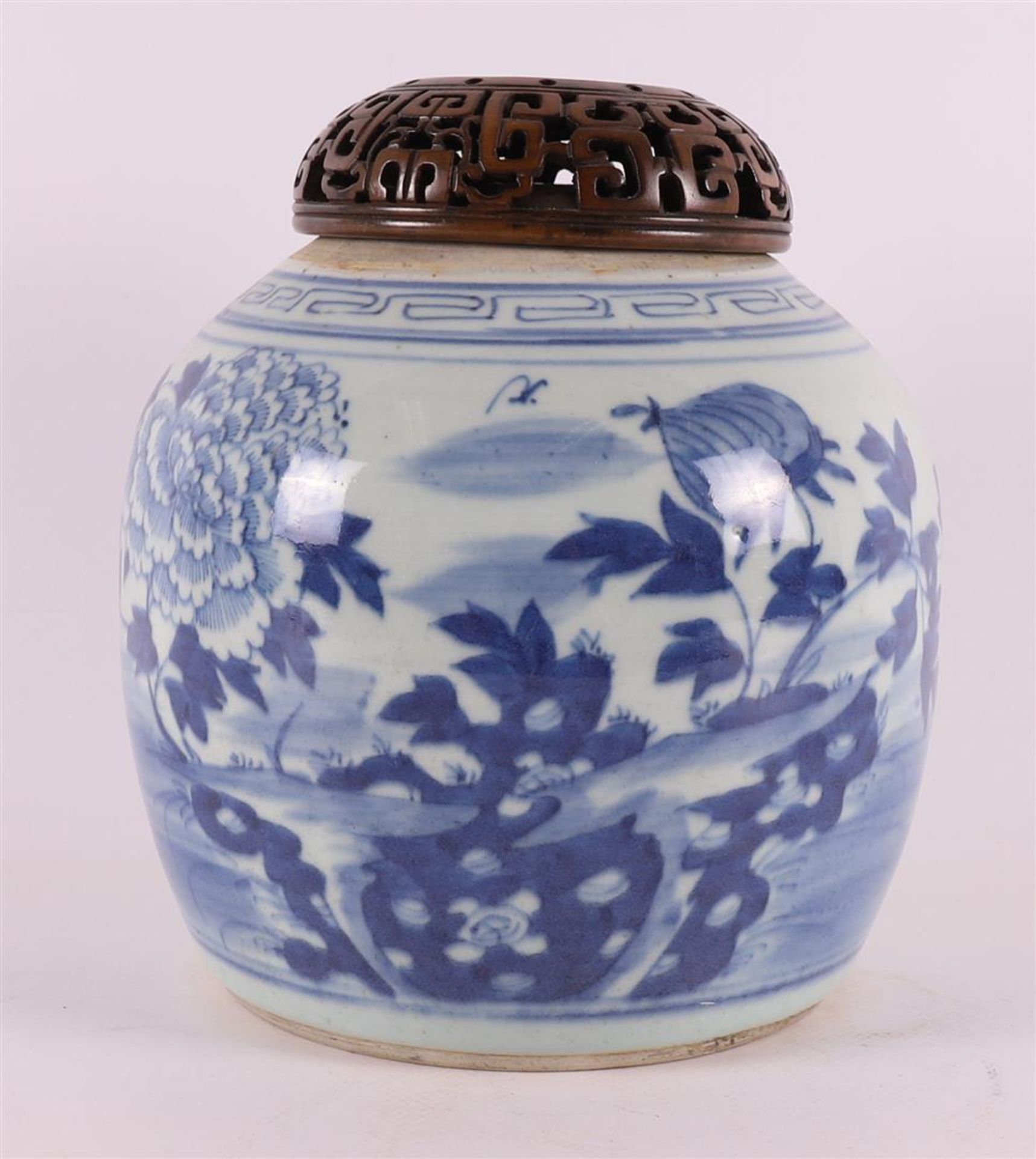 A blue and white porcelain ginger jar with pierced wooden lid, China, 19th centu