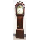 A longcase clock in oak case, England 19th century.