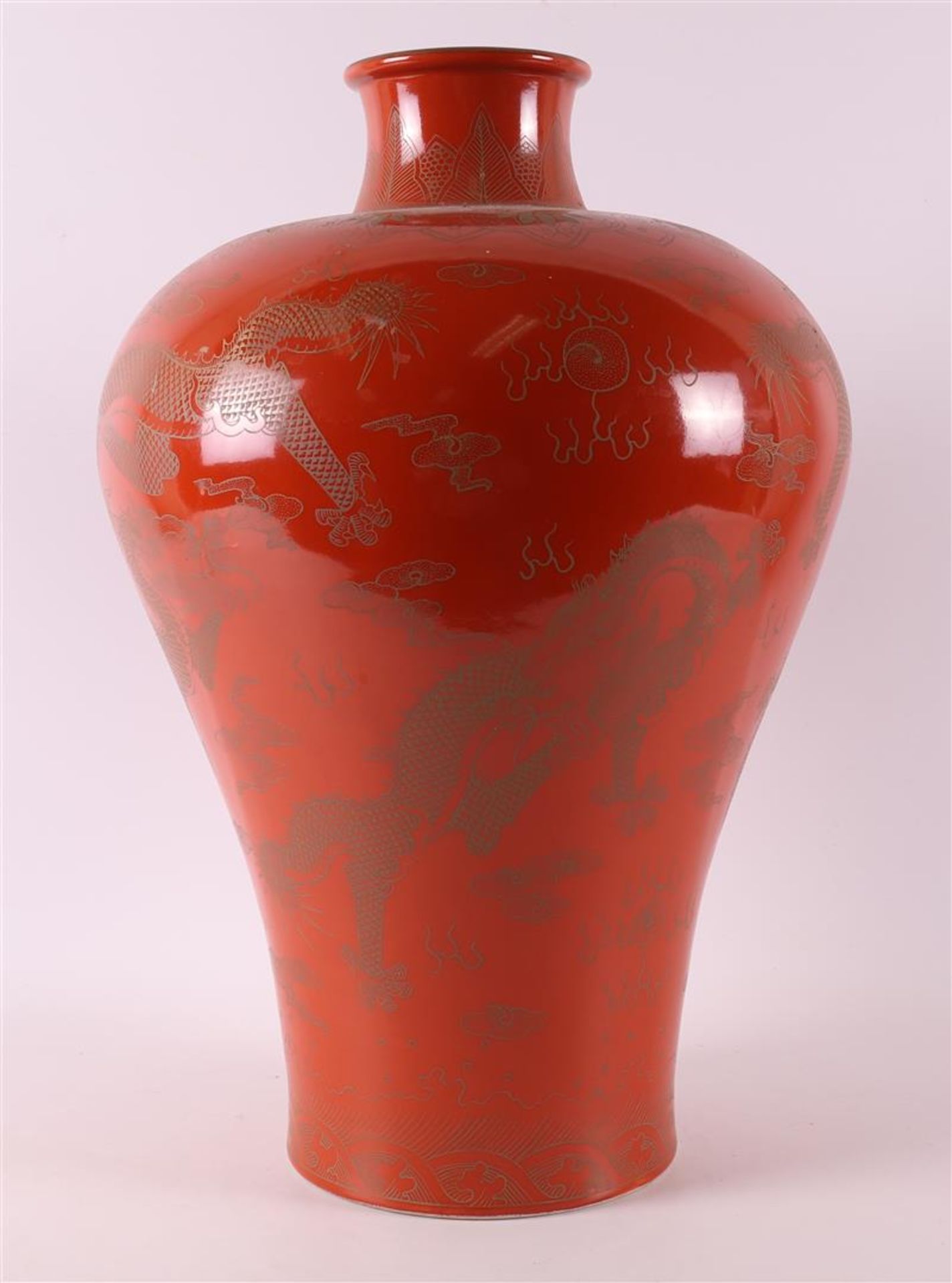 A red glazed porcelain meiping vase, after Qianlong, China, 21st century.