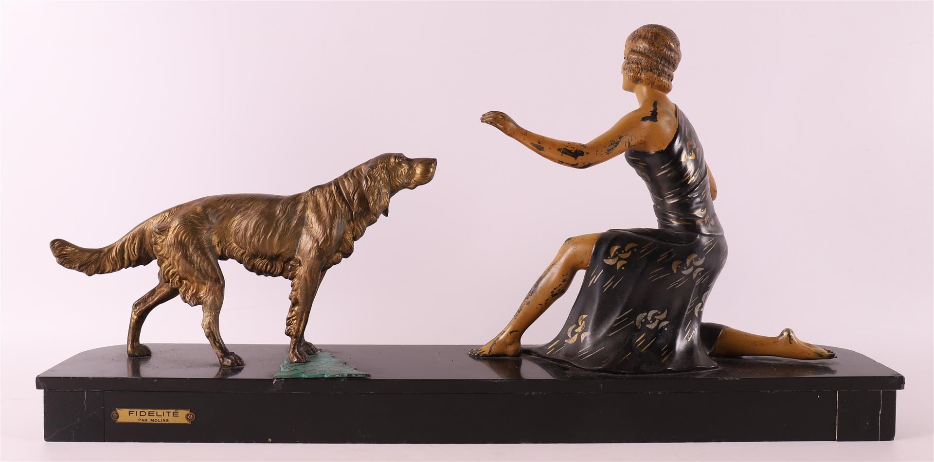 A white metal Art Deco sculpture of a woman with a hunting dog, France ca. 1920. - Image 2 of 2