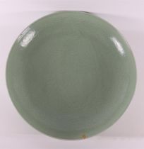 A capital celadon porcelain dish, China, after Ming, of later date.