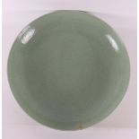 A capital celadon porcelain dish, China, after Ming, of later date.