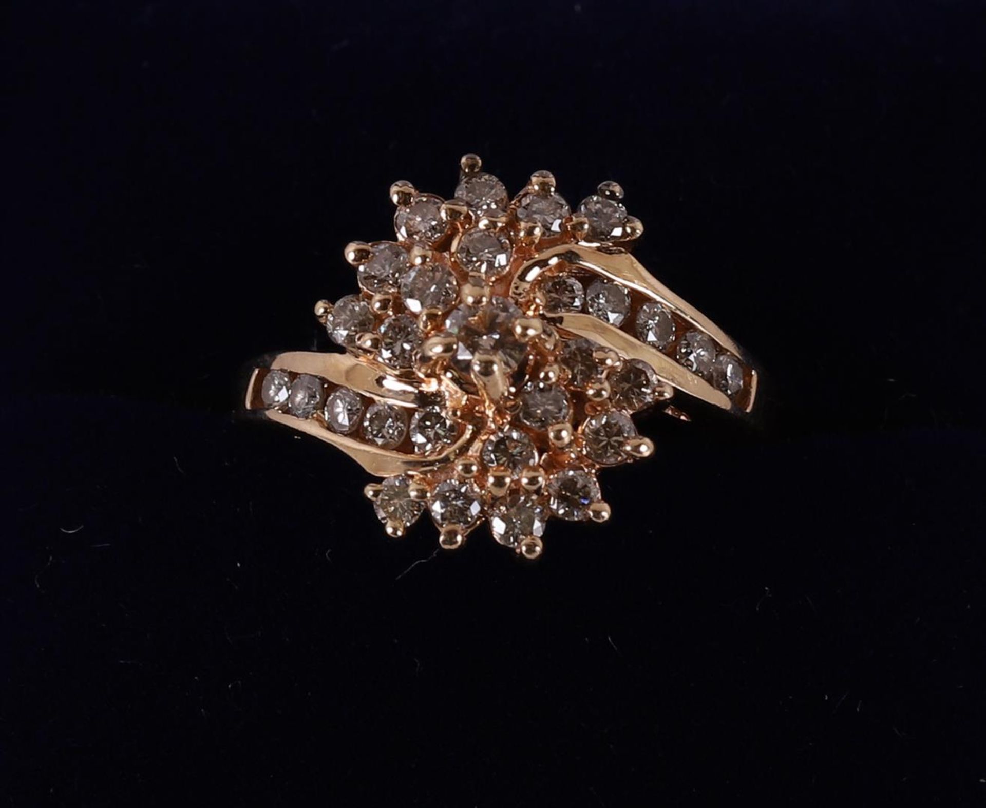 A 14 kt gold women's ring, set with 30 brilliant cut diamonds.