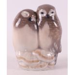 A polychrome porcelain pair of owls, Denmark, Royal Copenhagen, 20th century.