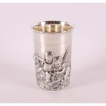 A 2nd grade 835/1000 silver birth cup with an image of putti.