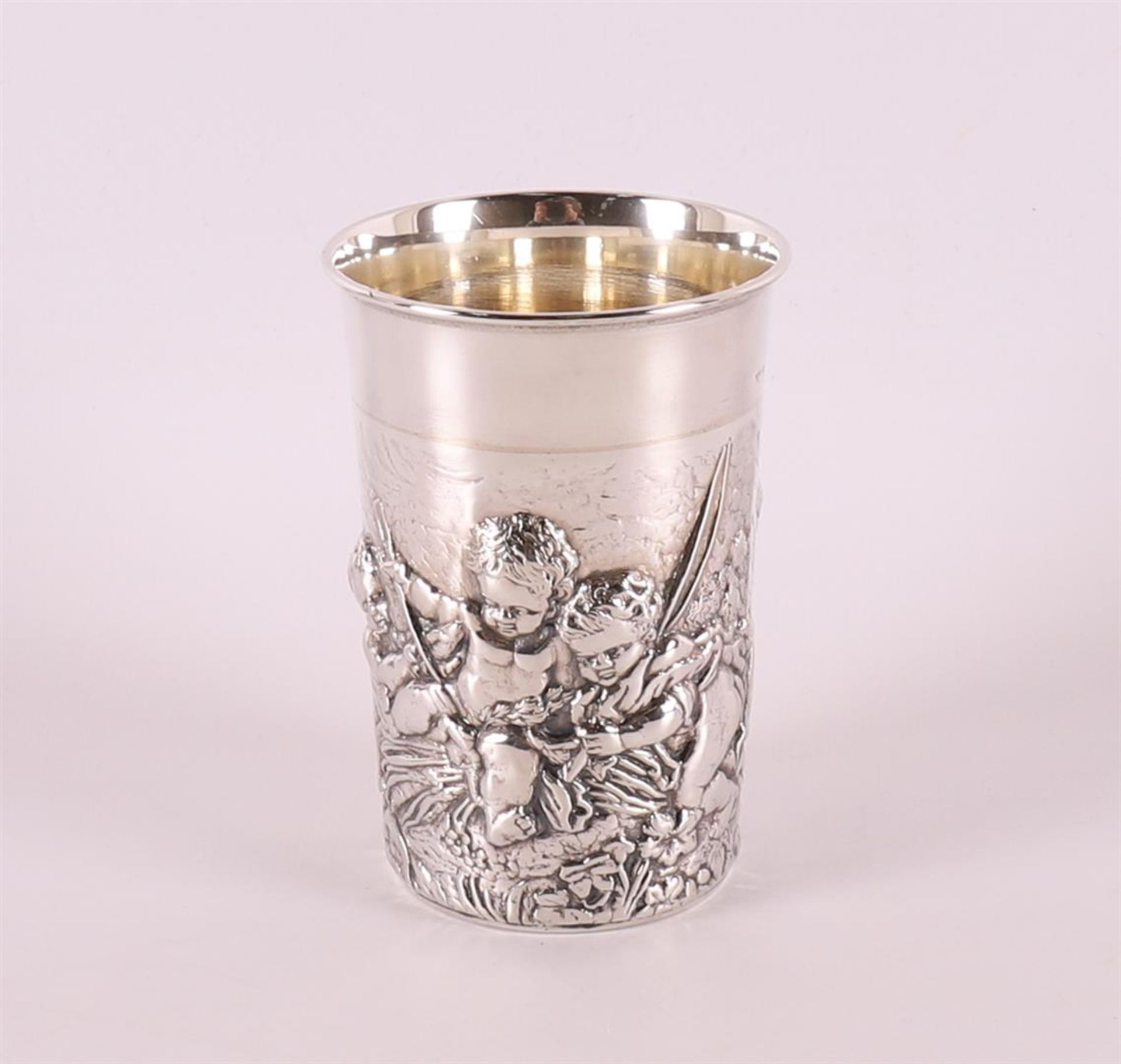 A 2nd grade 835/1000 silver birth cup with an image of putti.