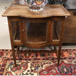 An oak tea cabinet with curved glazed front, ca. 1930,