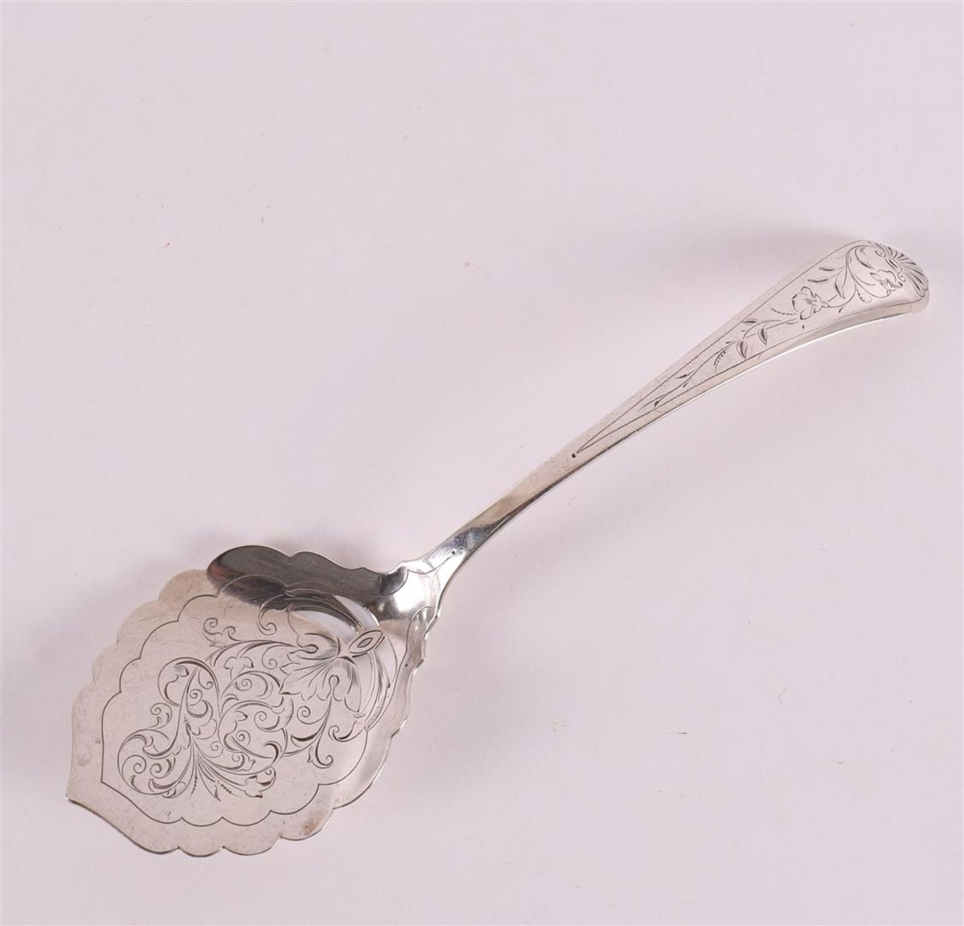 A second grade silver pie scoop, hammered floral decor. C.J. desire.