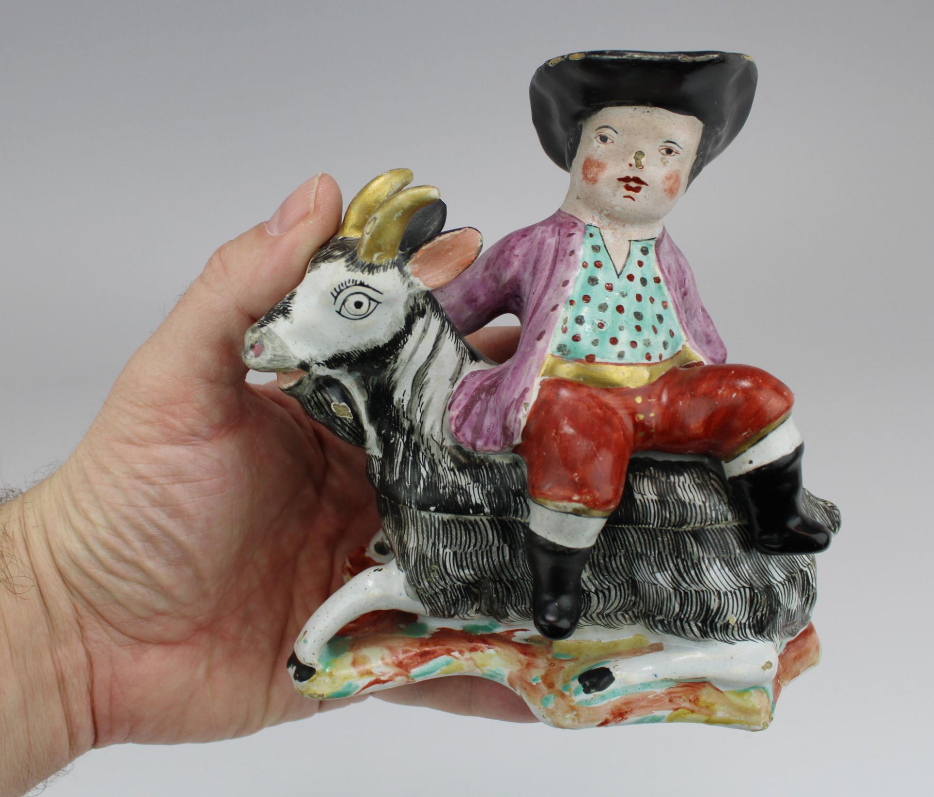 A Dutch Delft polychrome dish as a boy on a goat - Image 2 of 6