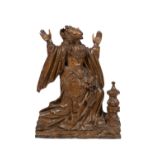 A Flemish carved oak figure of Mary Magdalene