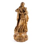 A Flemish carved limewood figure of the Virgin and Child atop the Globe