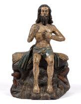 A Flemish carved and polychrome painted oak figure of Job on the dung heap
