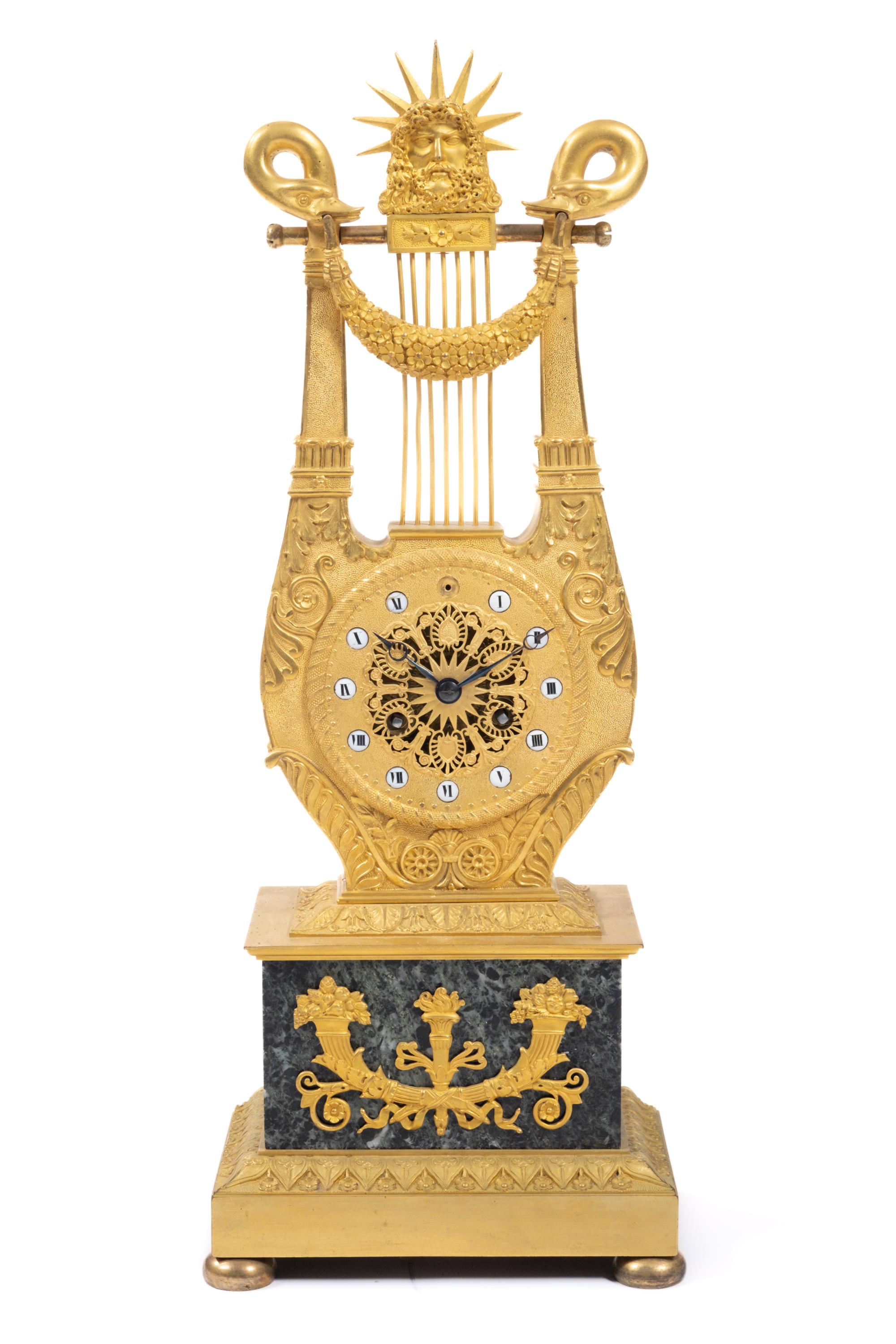 A Restauration ormolu and marble lyre mantel clock