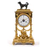 A French ormolu and patinated bronze mantel clock 'pendule portique'