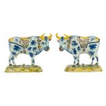 A pair of Delft polychrome pottery cows