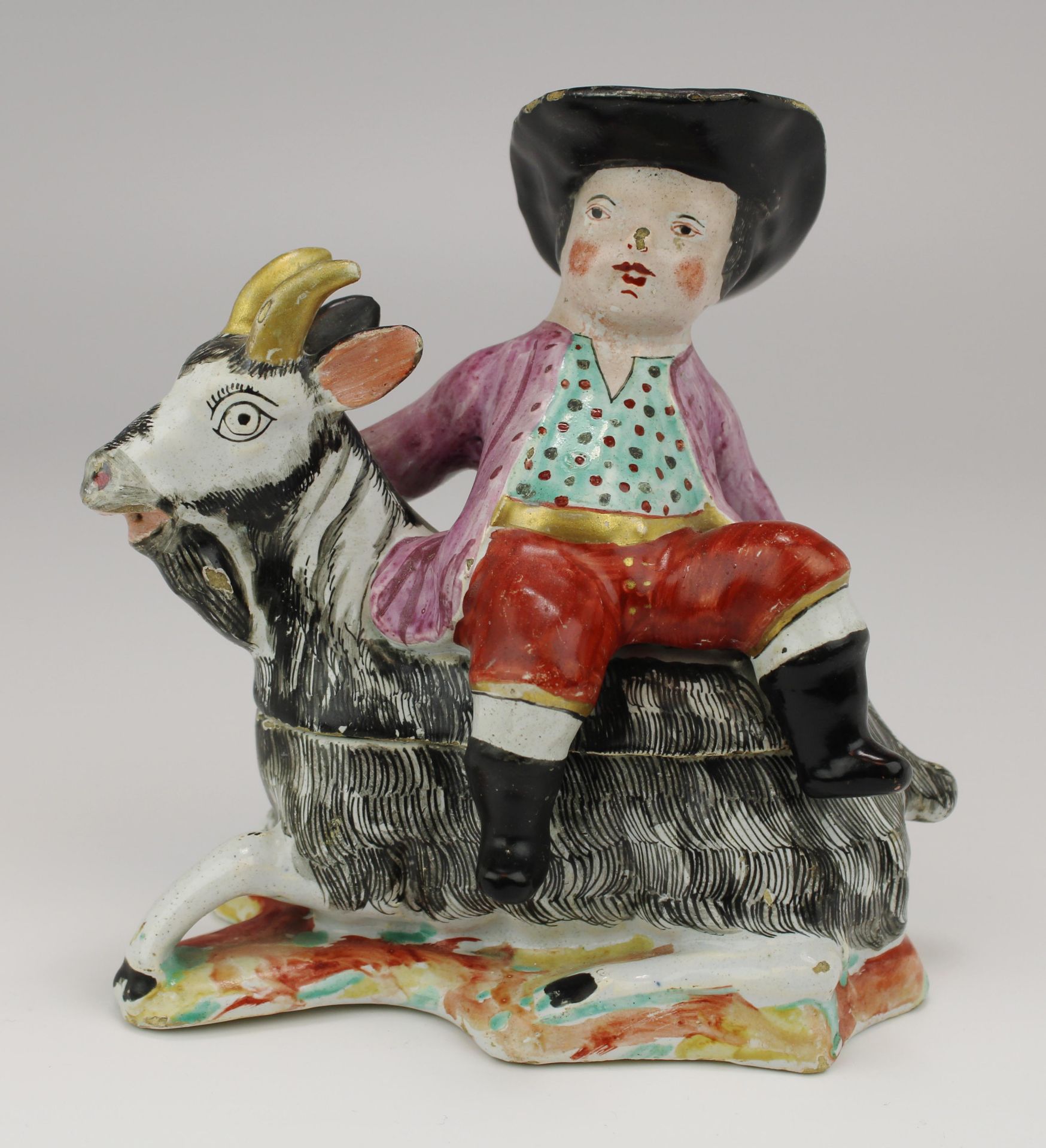 A Dutch Delft polychrome dish as a boy on a goat - Image 4 of 6