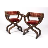 A pair of Italian walnut 'Dantesca' folding armchairs