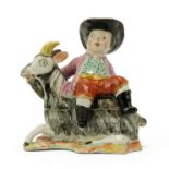 A Dutch Delft polychrome dish as a boy on a goat