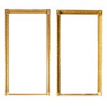 A large pair of Empire giltwood overmantel mirrors