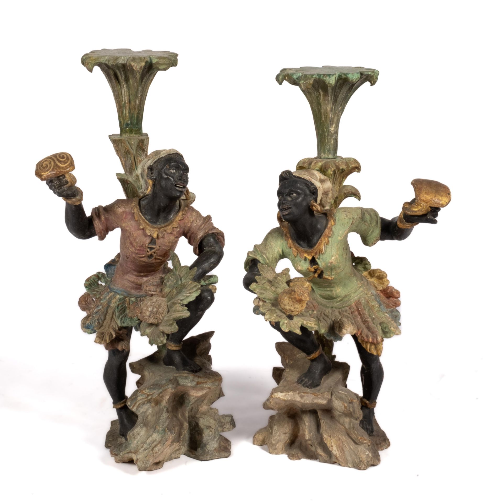 A pair of carved and polychrome painted figural pedestals