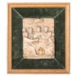A Malines carved and parcel-gilt alabaster relief 'The Wedding at Cana'