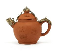 A miniature Delft red-brown yixing-style teapot