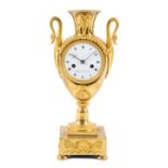 An Empire ormolu vase mantel clock