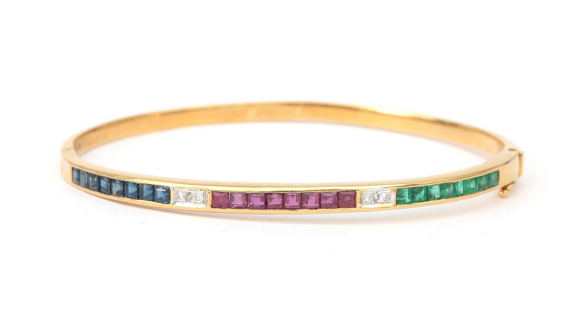 An 18 karat gold diamond, ruby, emerald and sapphire bangle