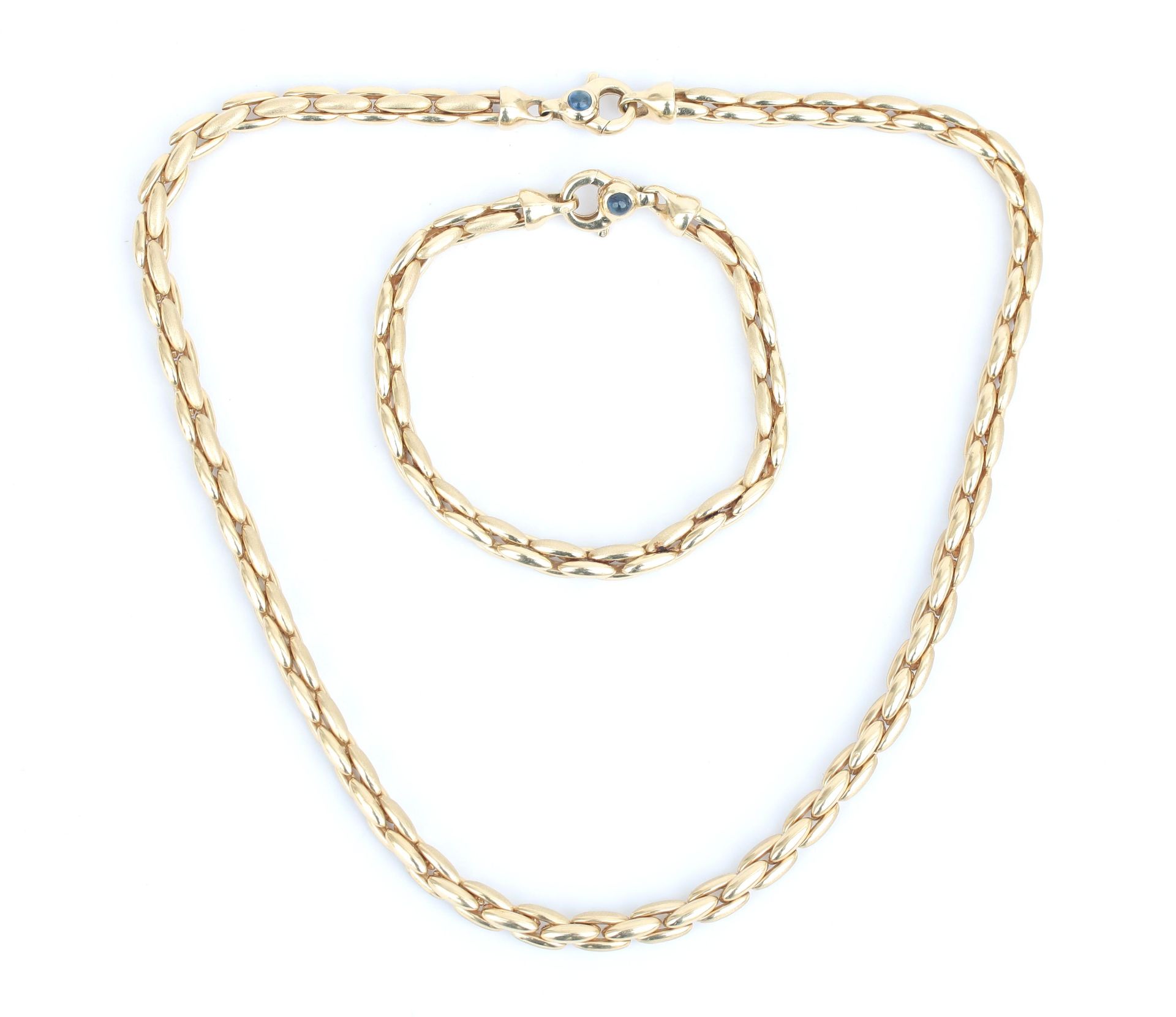 A 14 karat gold necklace with matching bracelet