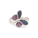 An 18 karat white gold butterfly ring with ruby and sapphire