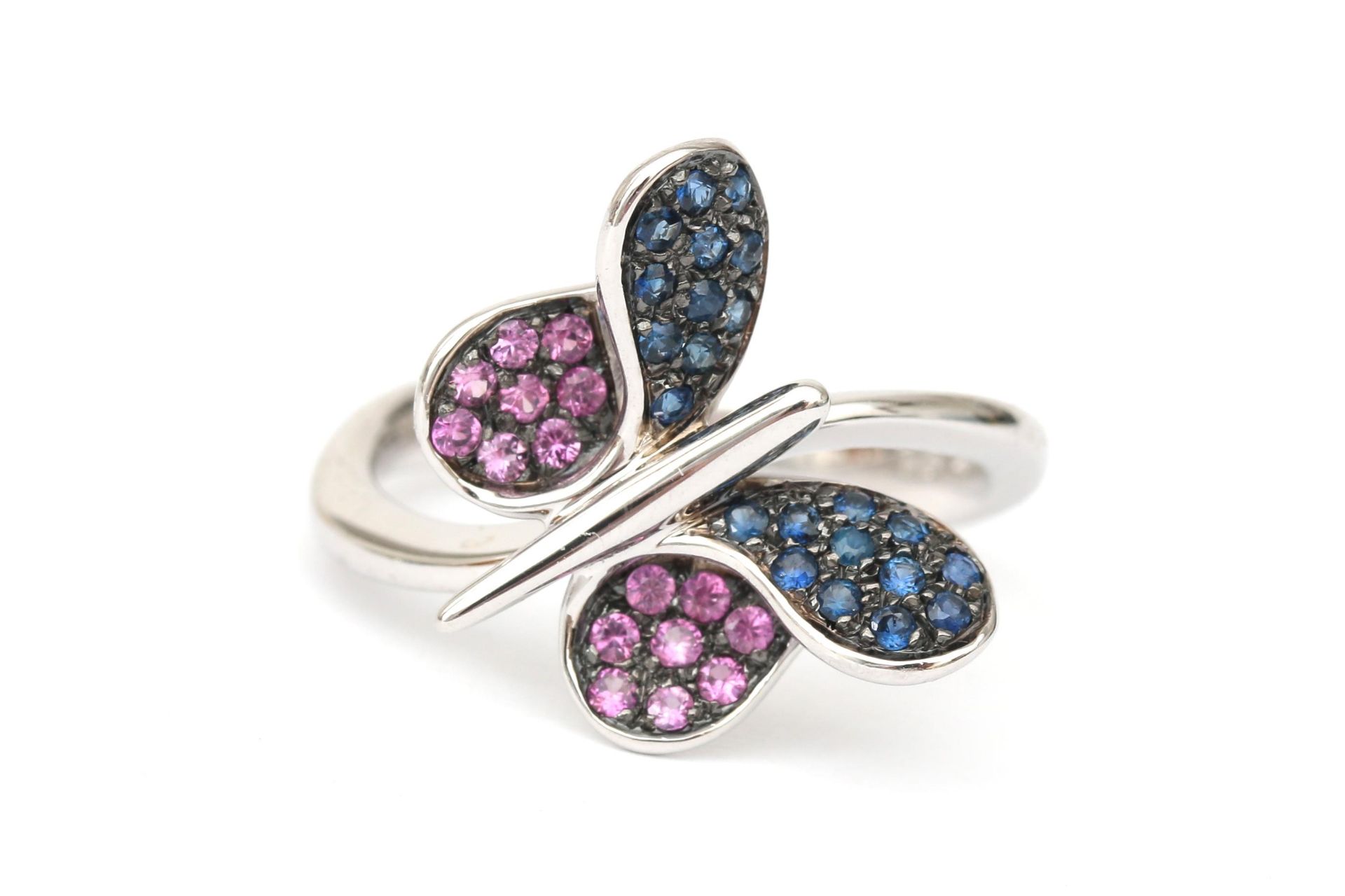 An 18 karat white gold butterfly ring with ruby and sapphire