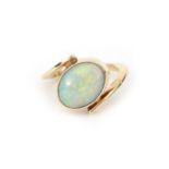 A 14 karat gold cross over opal ring