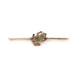 An 18 karat gold frog brooch with diamonds, demantoid and ruby.