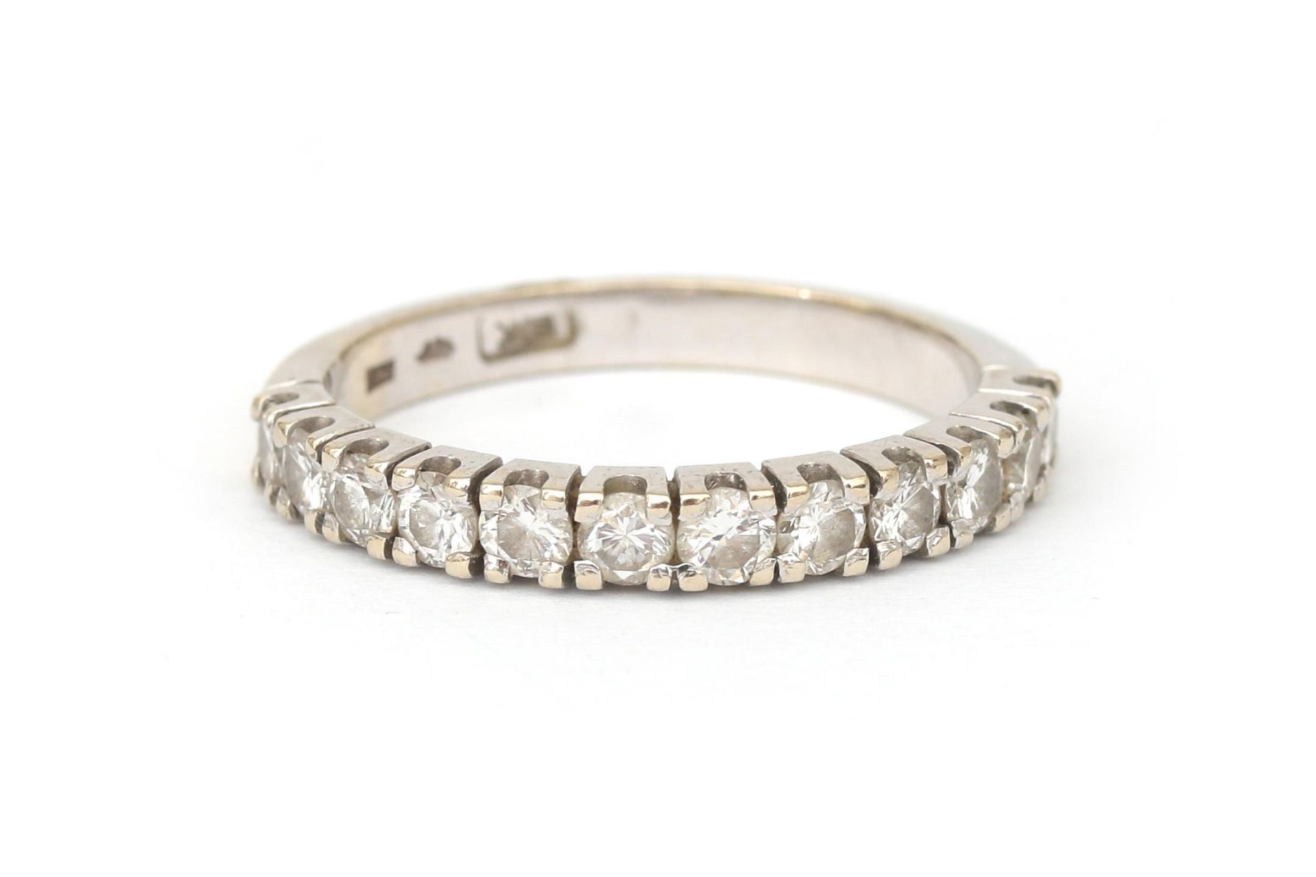 A 14 krt white gold half eternity band