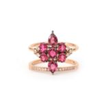 An 18 karat rose gold star shaped ruby and diamond cluster ring