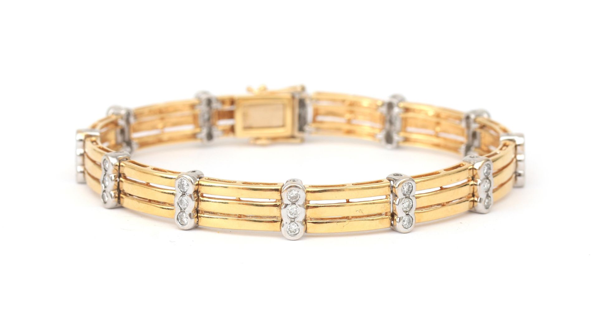 An 18 karat gold two tone diamond link bracelet